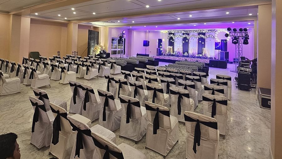 Image showcasing the spacious ballroom with rows of chairs, ideal for conferences and seminars.
